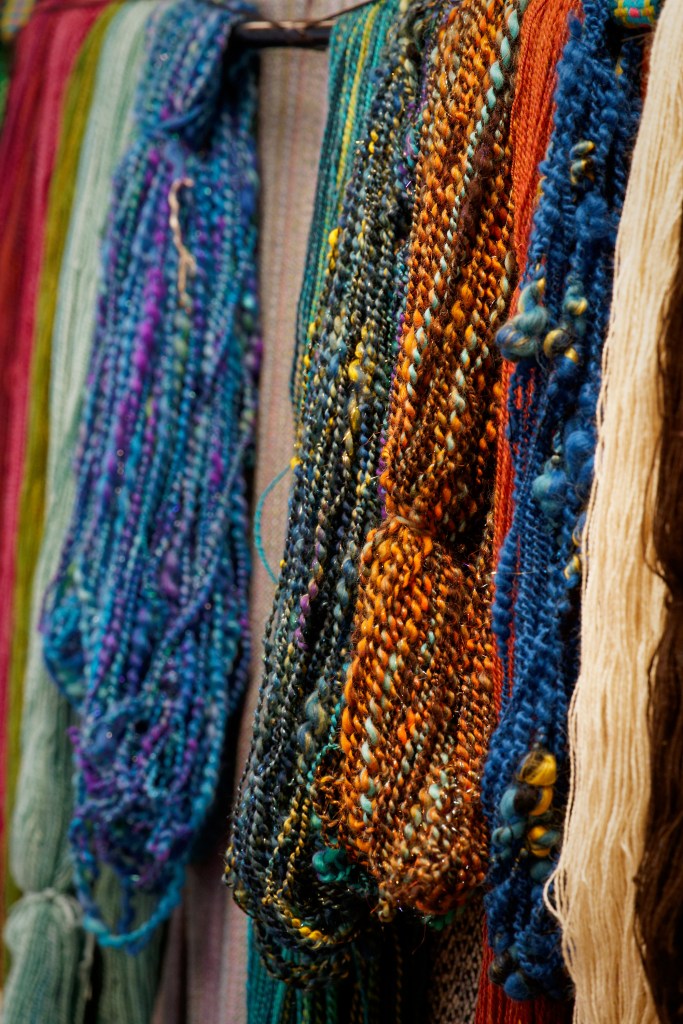 A display of colorful yarn skeins.