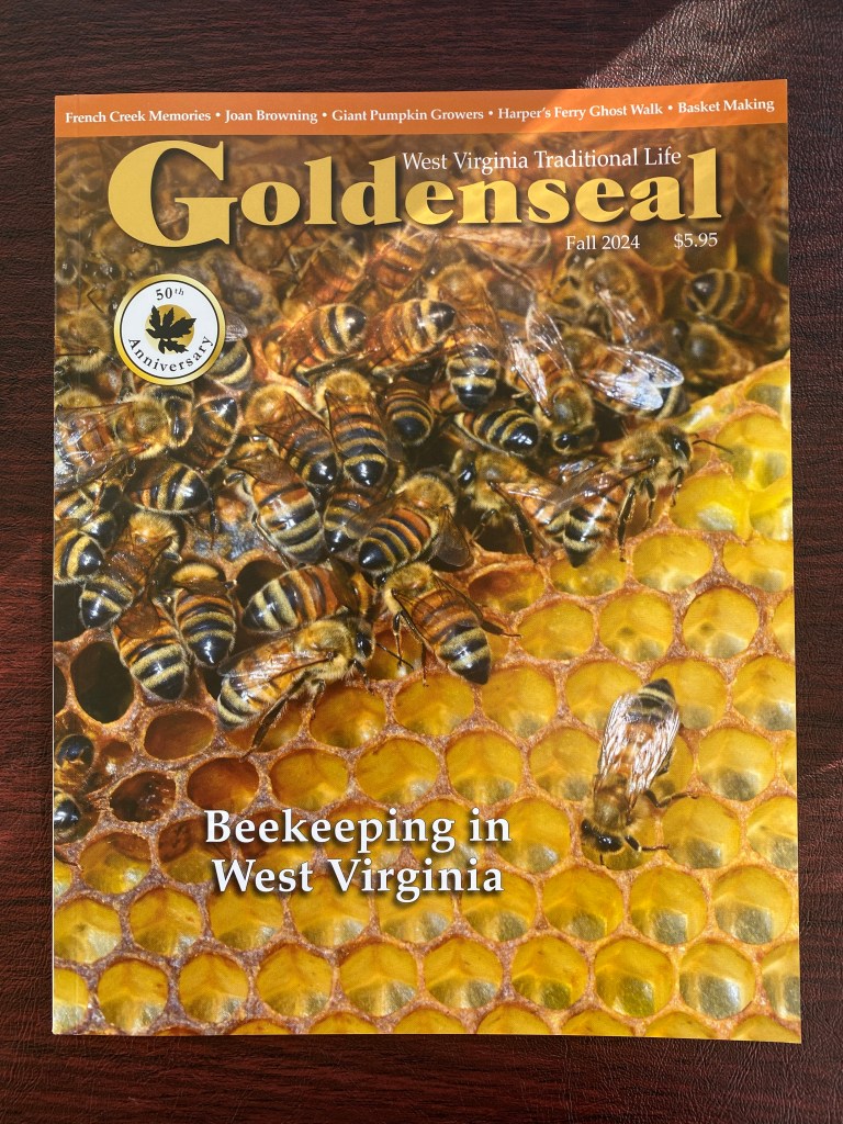 A magazine cover of Goldenseal, with a picture of a honey comb and bees on the cover.